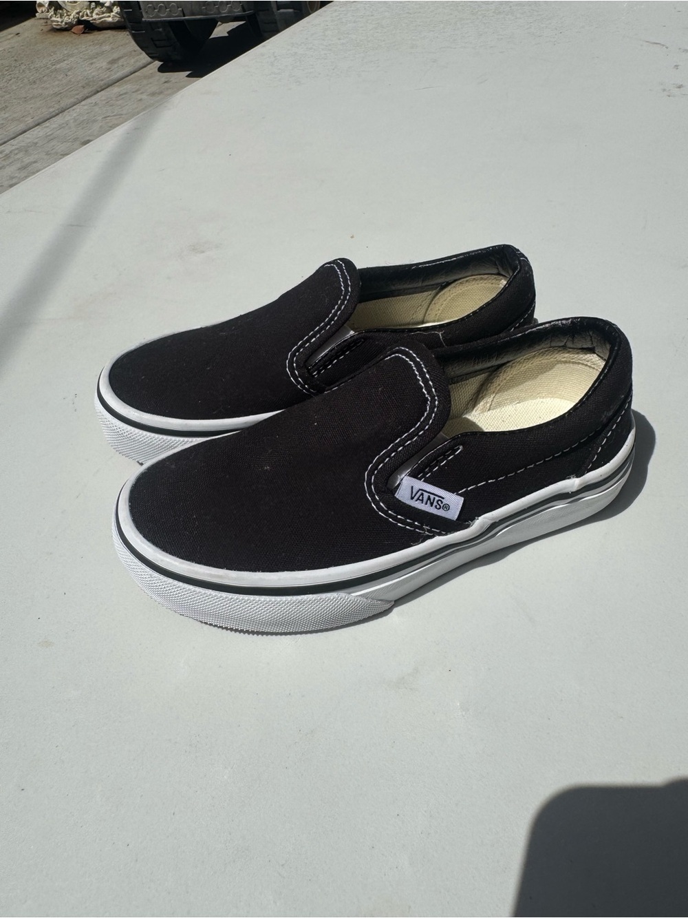 Vans Black & White Slip-On Canvas Sneakers